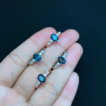 KJJEAXCMY jemné šperky 925 sterling silver vykladané prírodné blue topaz krúžok s hladké krivky a odvážne oválny tvar 1 karát